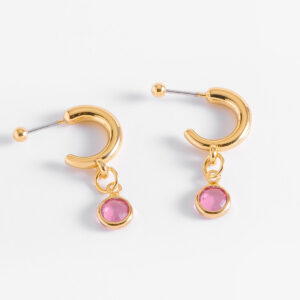 Aretes tipo media luna en oro con piedra rosa